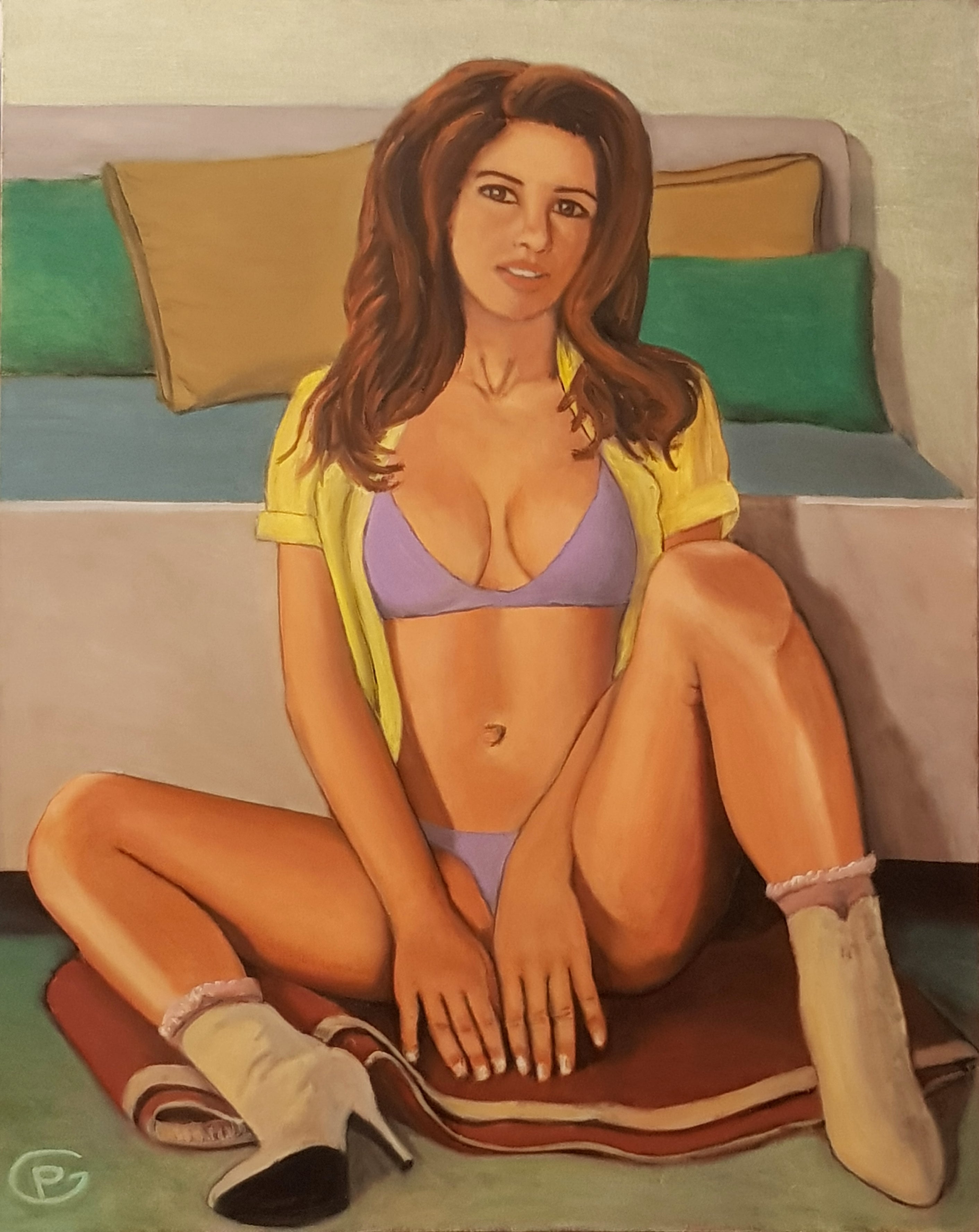 Mujer sentada a los pies de la cama