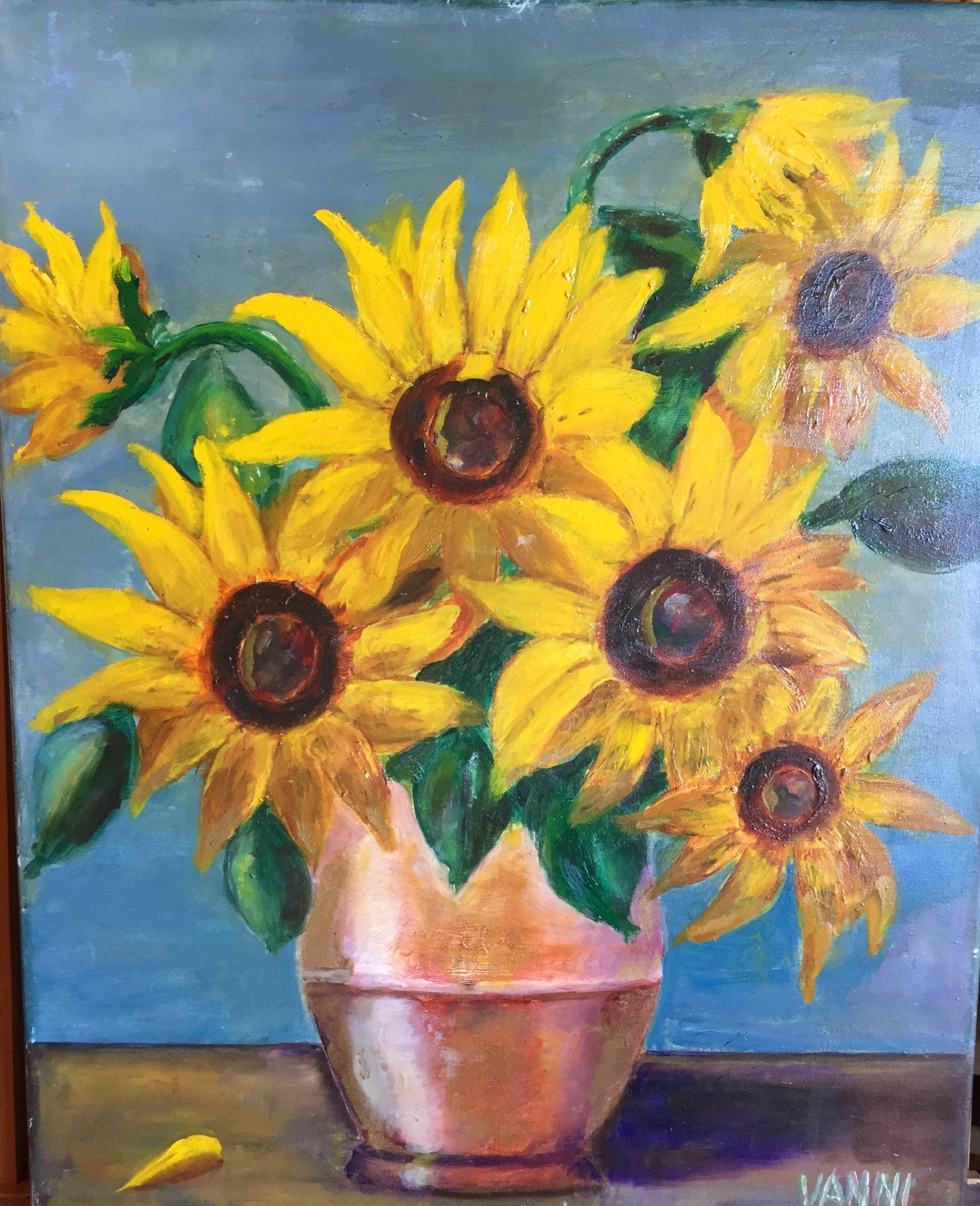Sunflowers in a copper vase