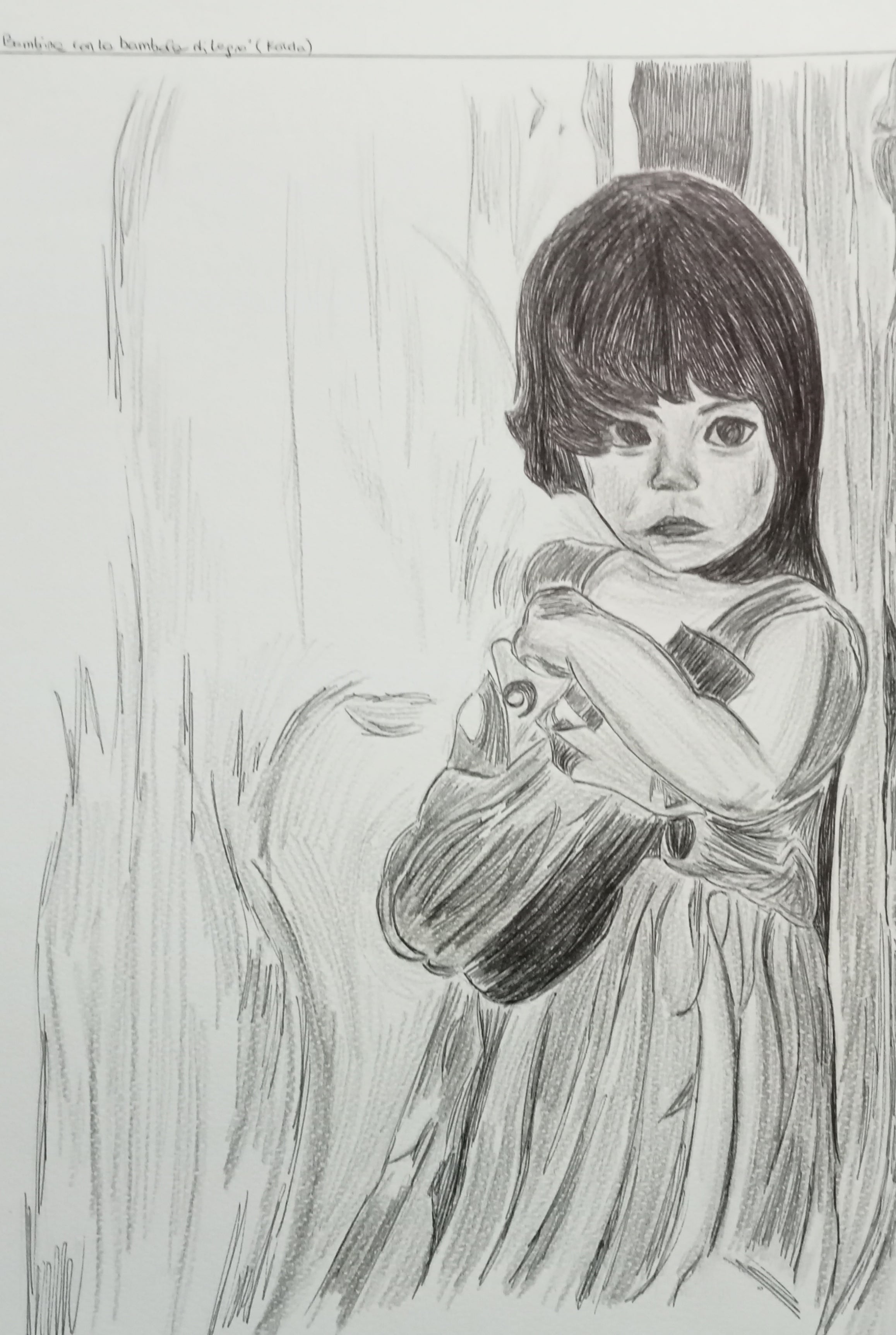 "La bambina con la bambola di legno"